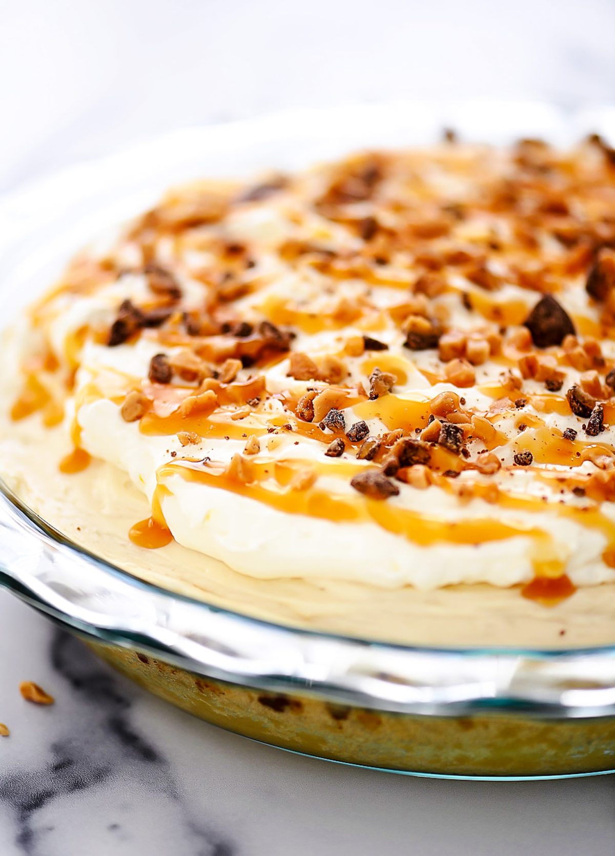 Caramel Cream Pie is filled with a sweet cream cheese and caramel filling over a sugar cookie crust.