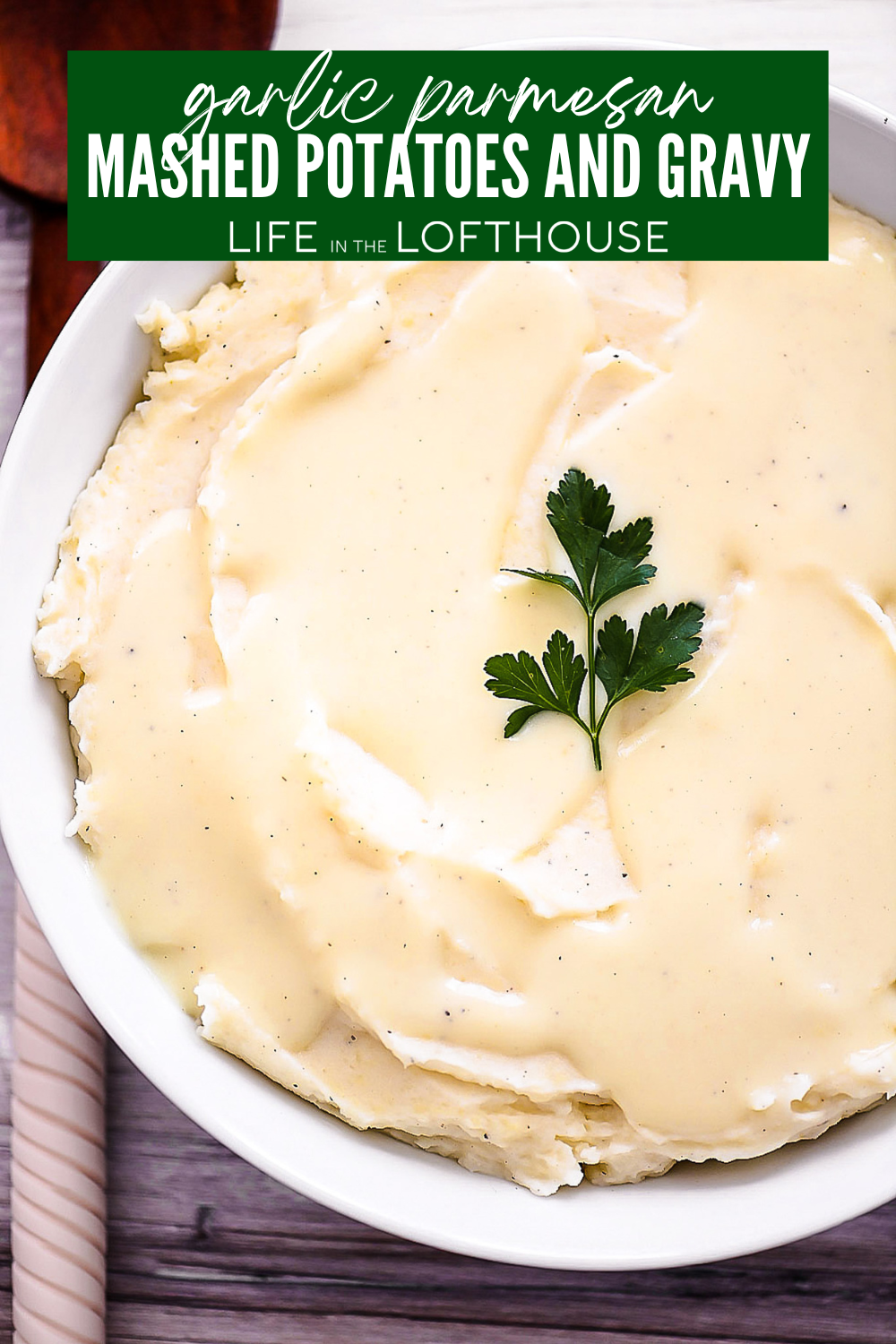 Garlic Parmesan Mashed Potatoes and Gravy in a white bowl