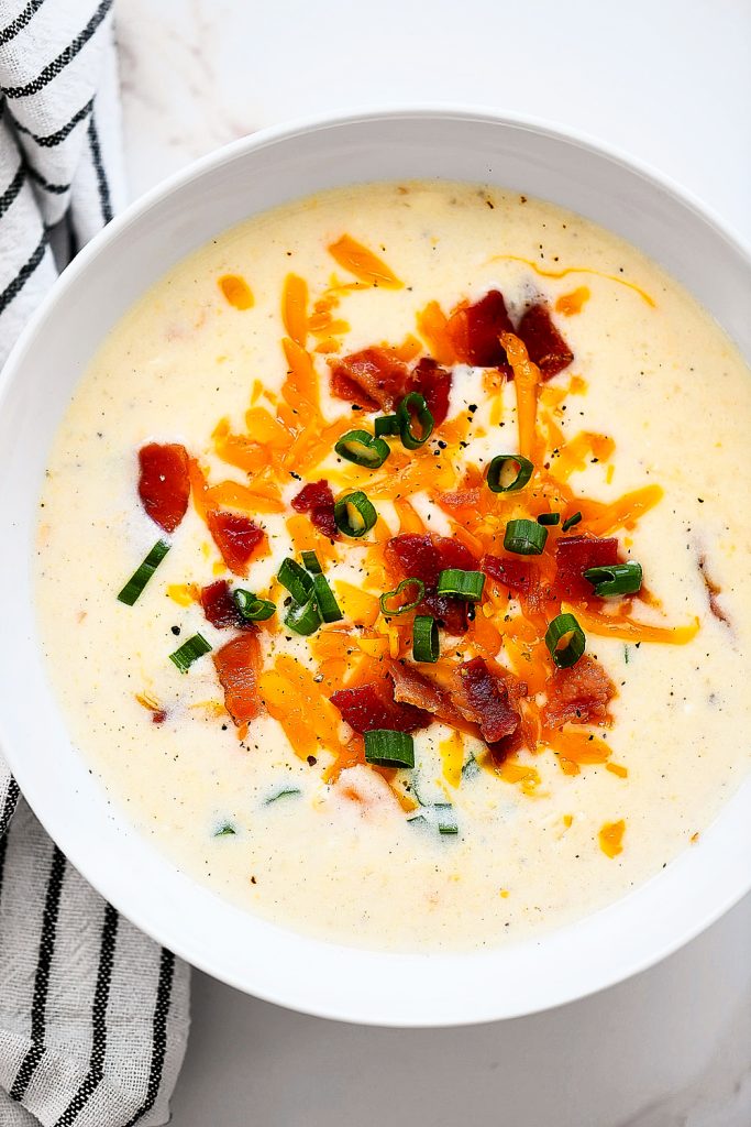 Creamy potato soup with bacon, cheese and green onions.