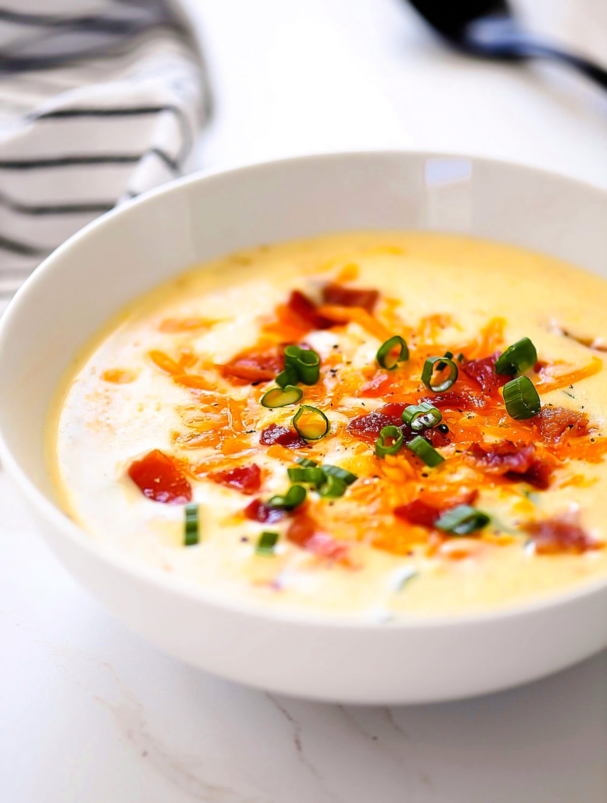 Creamy potato soup with bacon, cheese and green onions.
