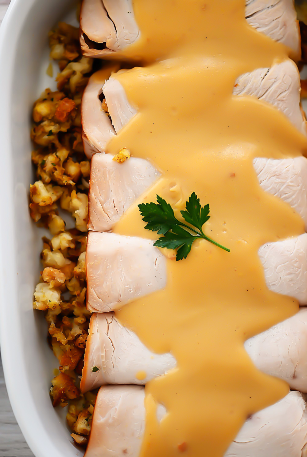 Turkey and Stuffing Roll Ups start with slices of turkey that are rolled up with turkey stuffing and then topped off with a delicious turkey gravy. Life-in-the-Lofthouse.com