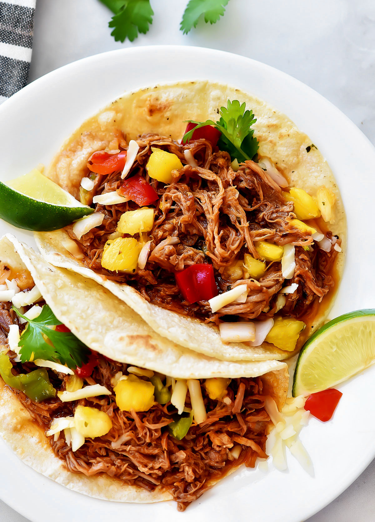 Shredded sweet pork with corn tortillas.