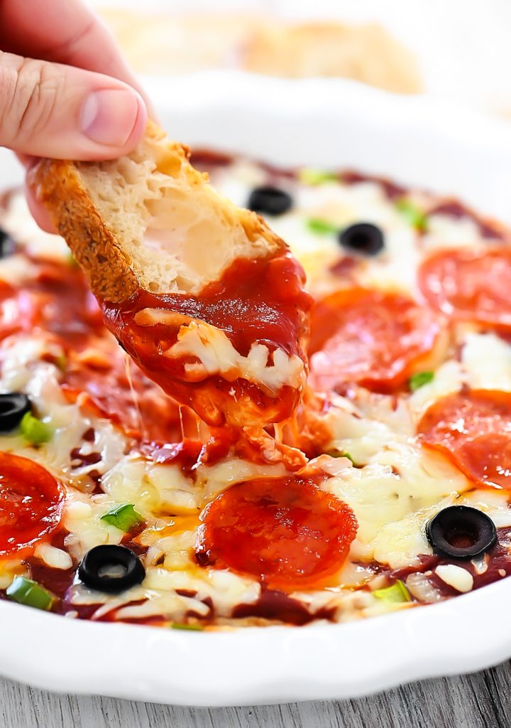 Warm Pizza Dip with two cheeses, pizza sauce and toppings.