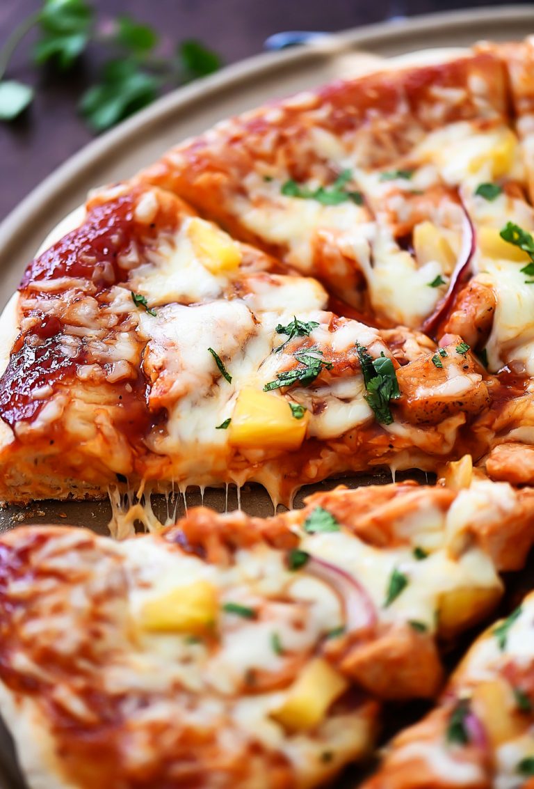 This Hawaiian BBQ Chicken Pizza is loaded with cheese, barbecue sauce, pineapple, red onion and cilantro. Life-in-the-Lofthouse.com