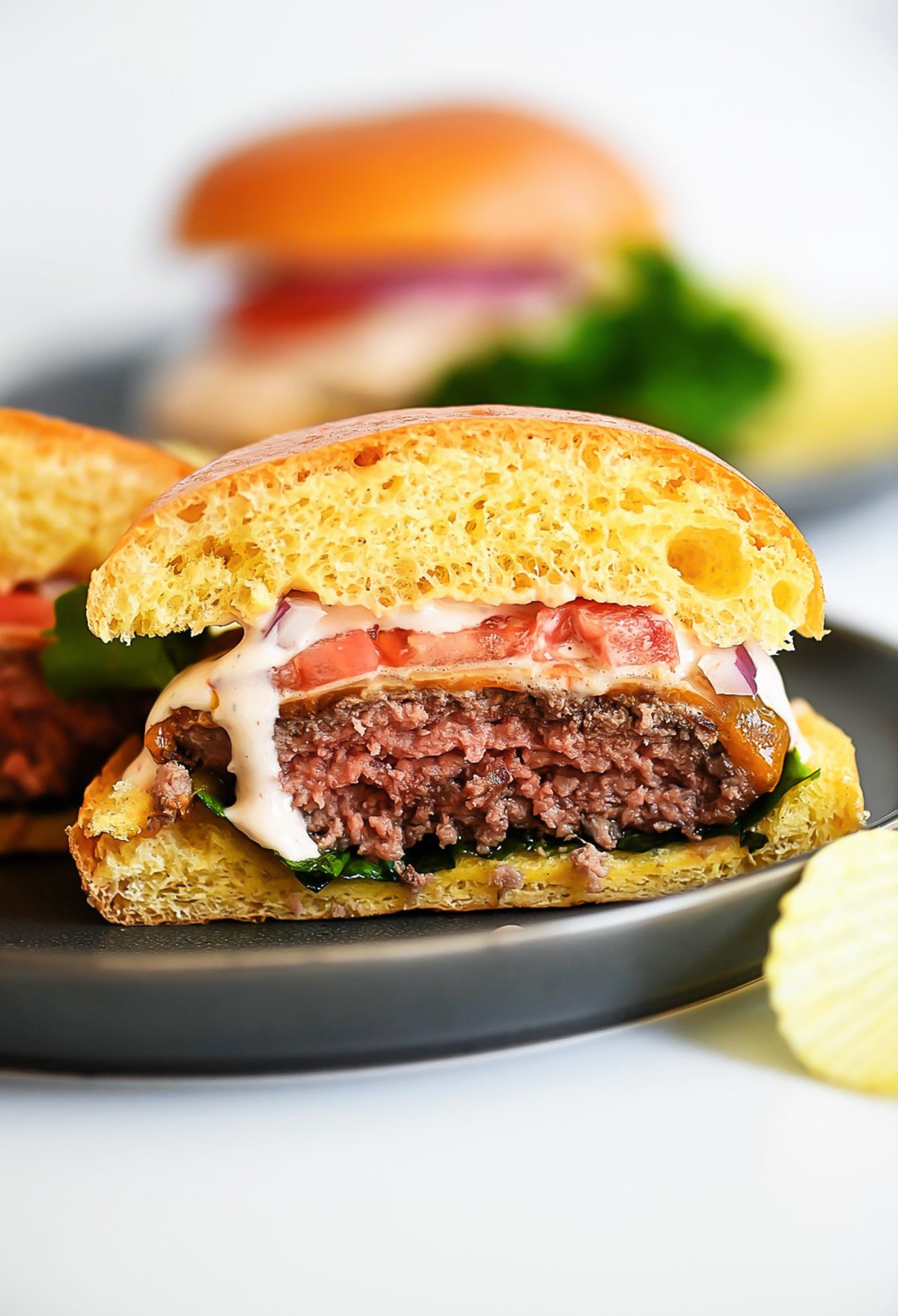 Chipotle Ranch Burgers are juicy burgers fresh off the grill smothered in chipotle ranch dressing, cheese, lettuce and tomato. Life-in-the-Lofthouse.com