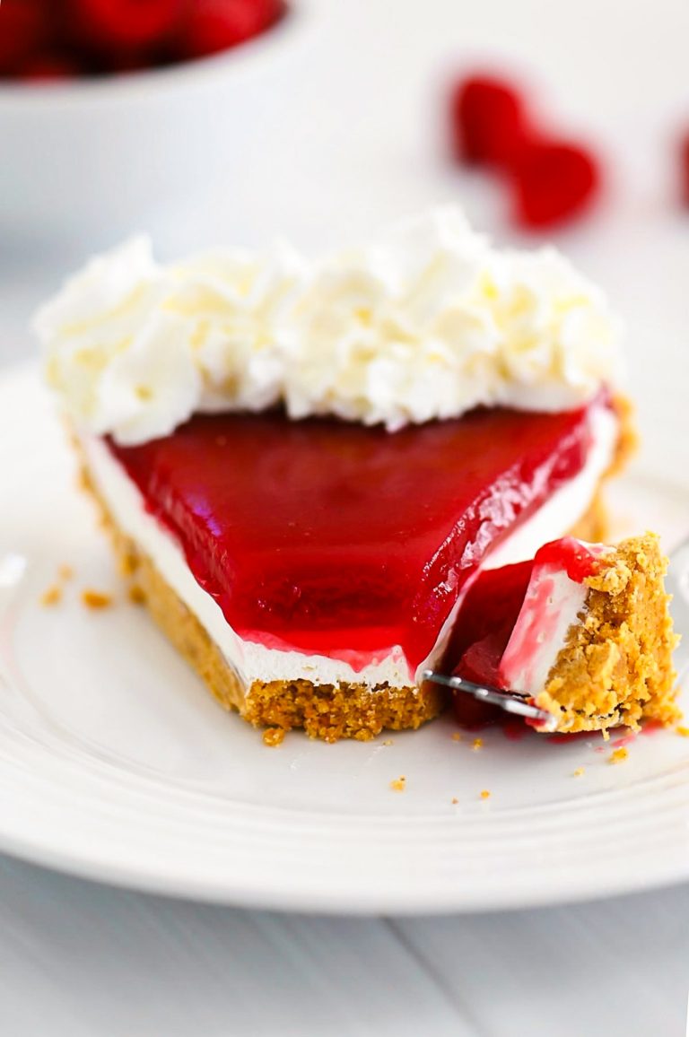 Raspberry Cream Pie has a graham cracker crust, cream cheese filling and raspberry topping!