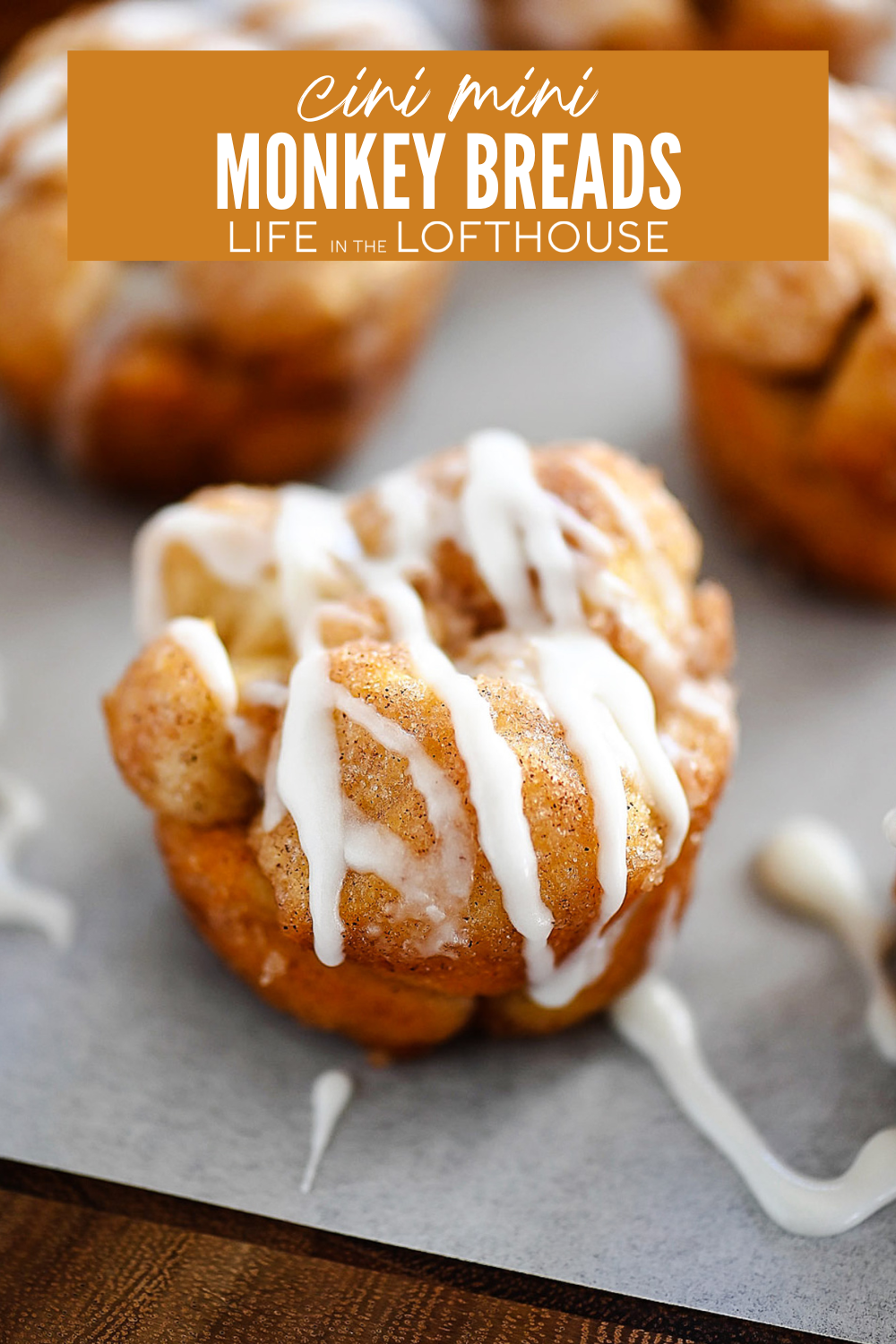 Cini Mini Monkey Breads are covered in cinnamon and sugar then topped with a sweet vanilla glaze. You are sure to fall in love with these little pull-apart breads!