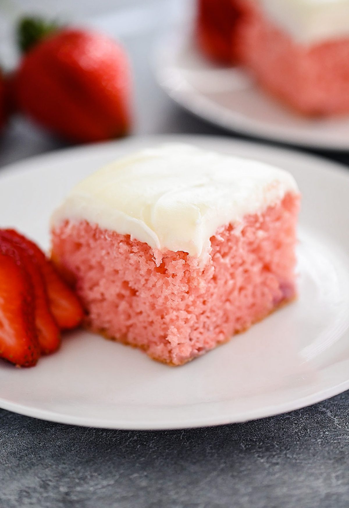 A sweet strawberry cake filled with fresh strawberries and topped with cream cheese frosting. Life-in-the-Lofthouse.com