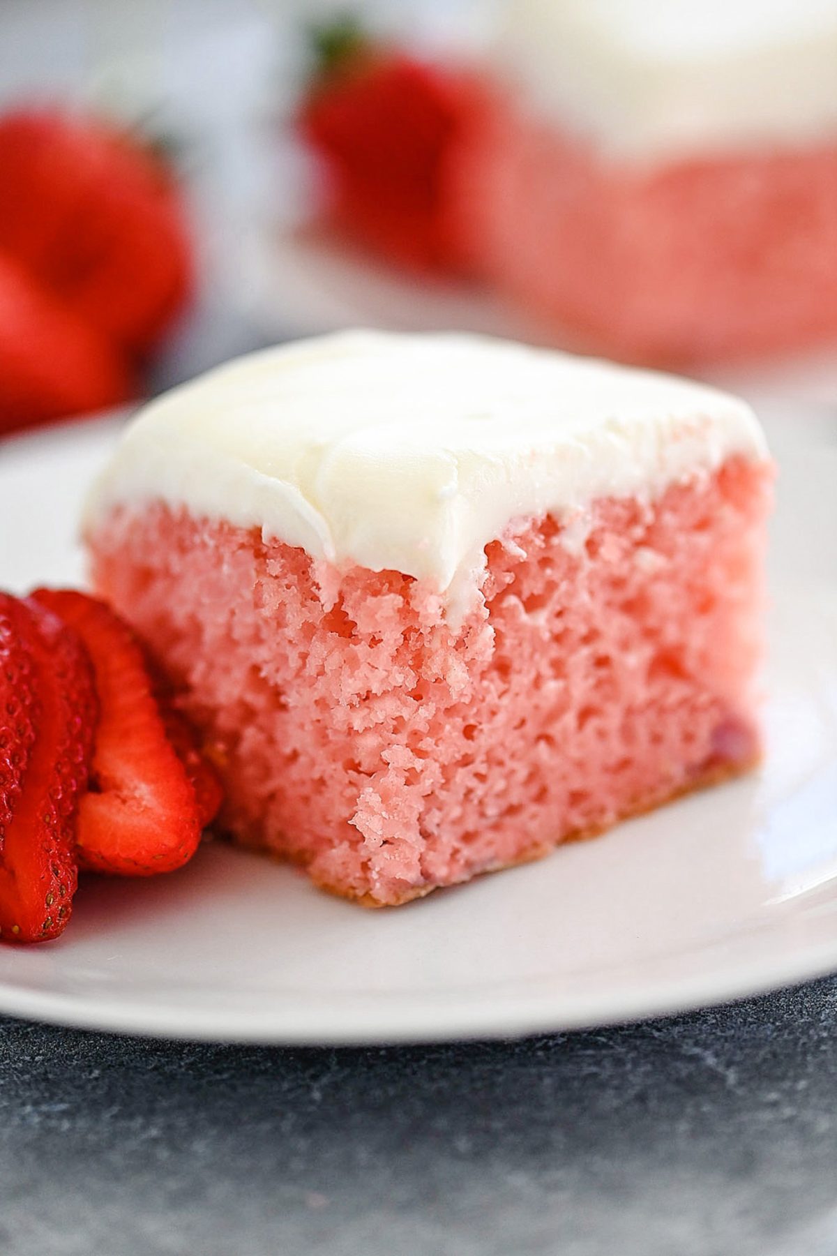 A sweet strawberry cake filled with fresh strawberries and topped with cream cheese frosting. Life-in-the-Lofthouse.com