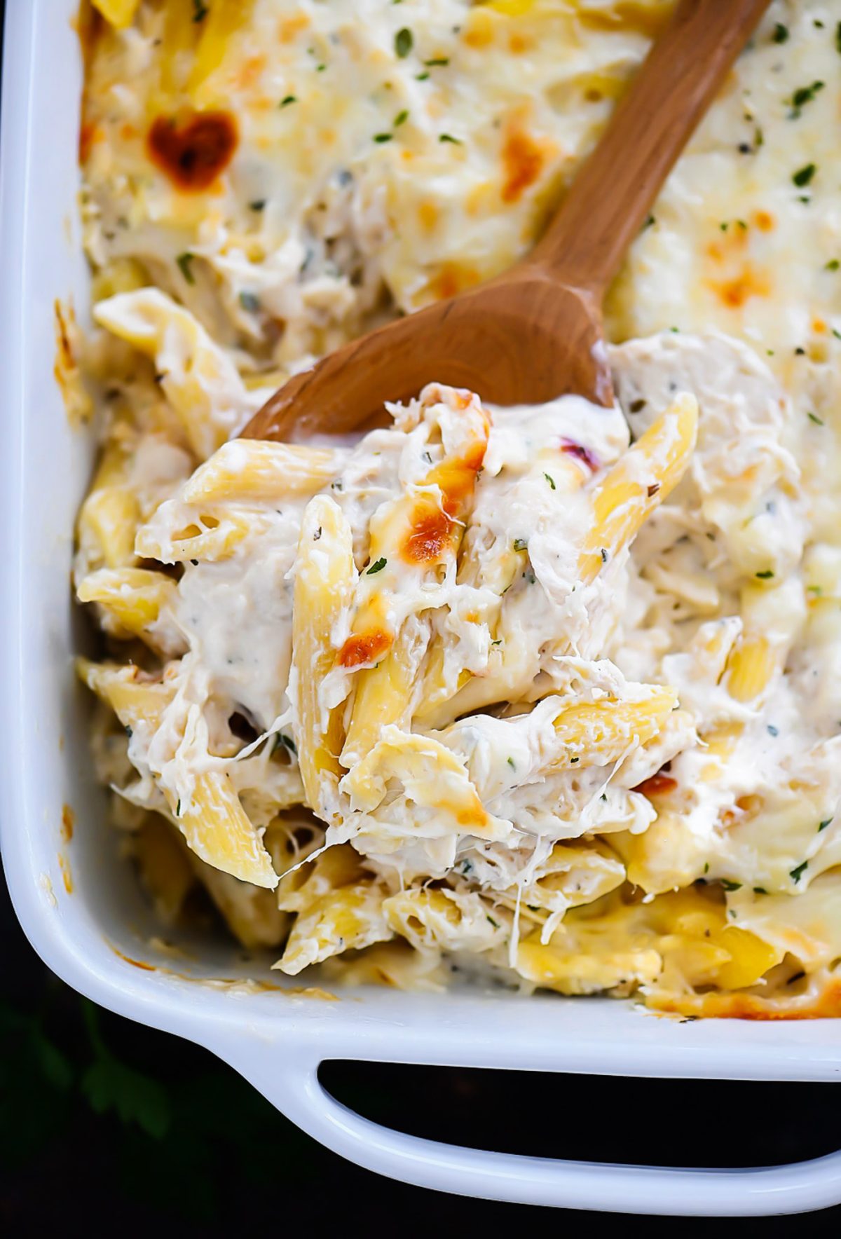 Three Cheese Chicken Alfredo Bake is cheesy, creamy heaven with Ricotta, Parmesan and Mozzarella cheese. Life-in-the-Lofthouse.com