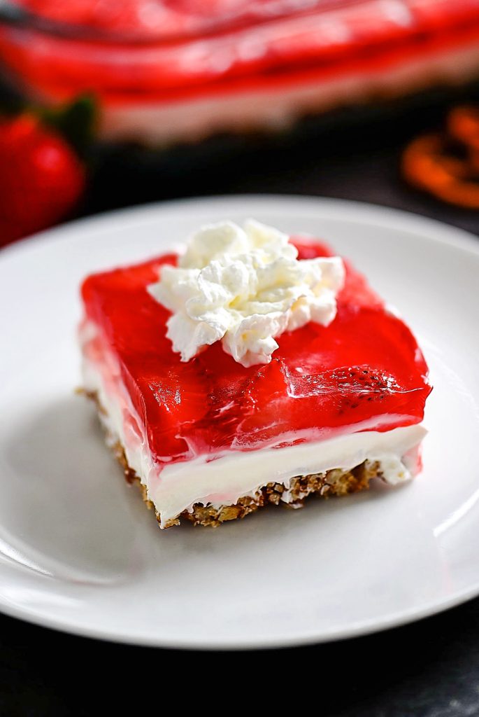 Pretzel salad with cream cheese filling and strawberries.