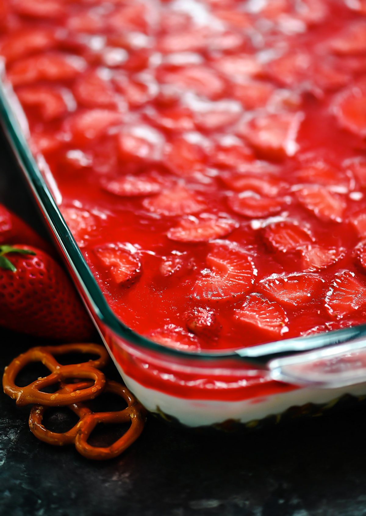 Pretzel salad with cream cheese filling and strawberries.