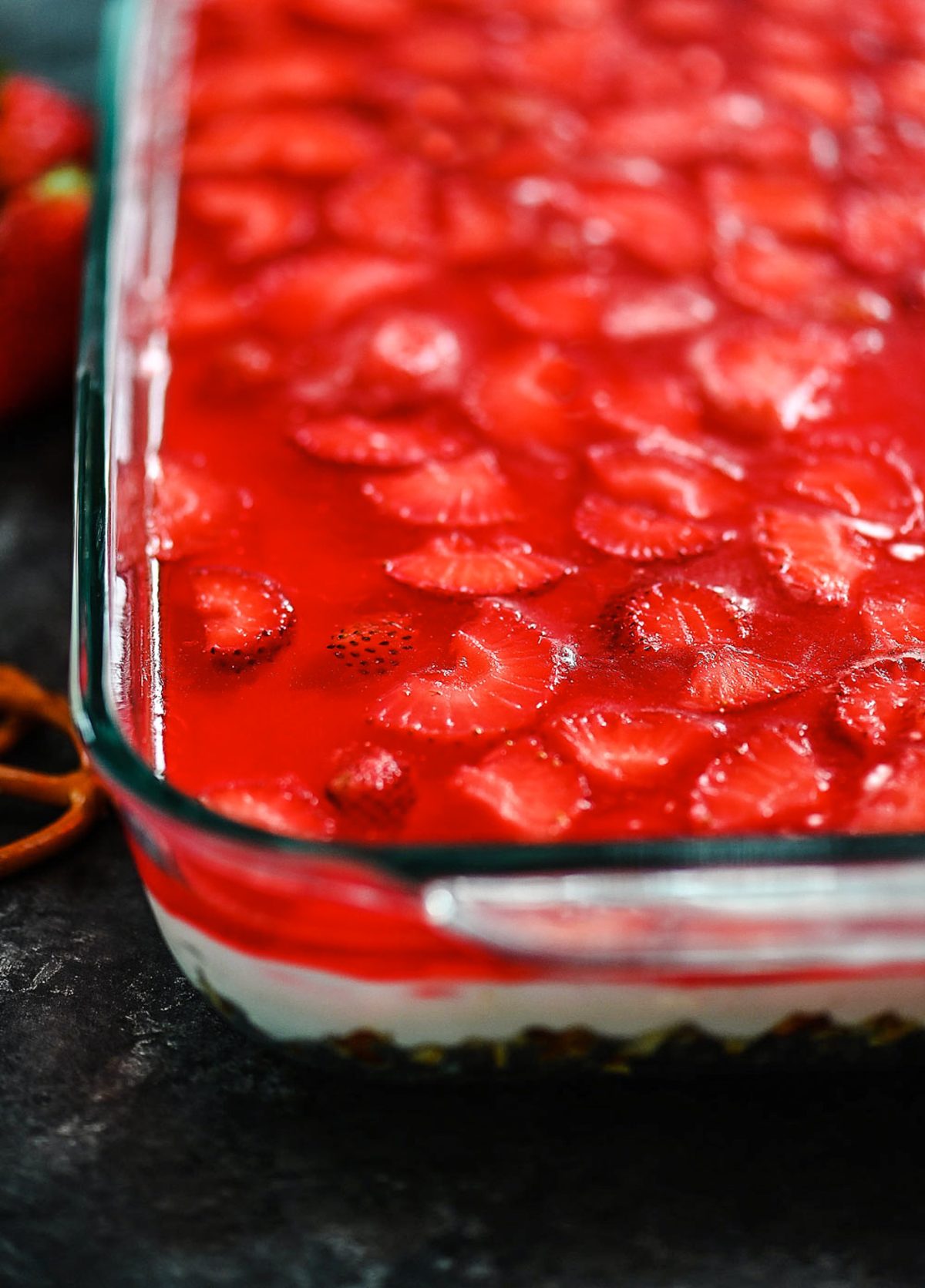 Pretzel salad with cream cheese filling and strawberries.