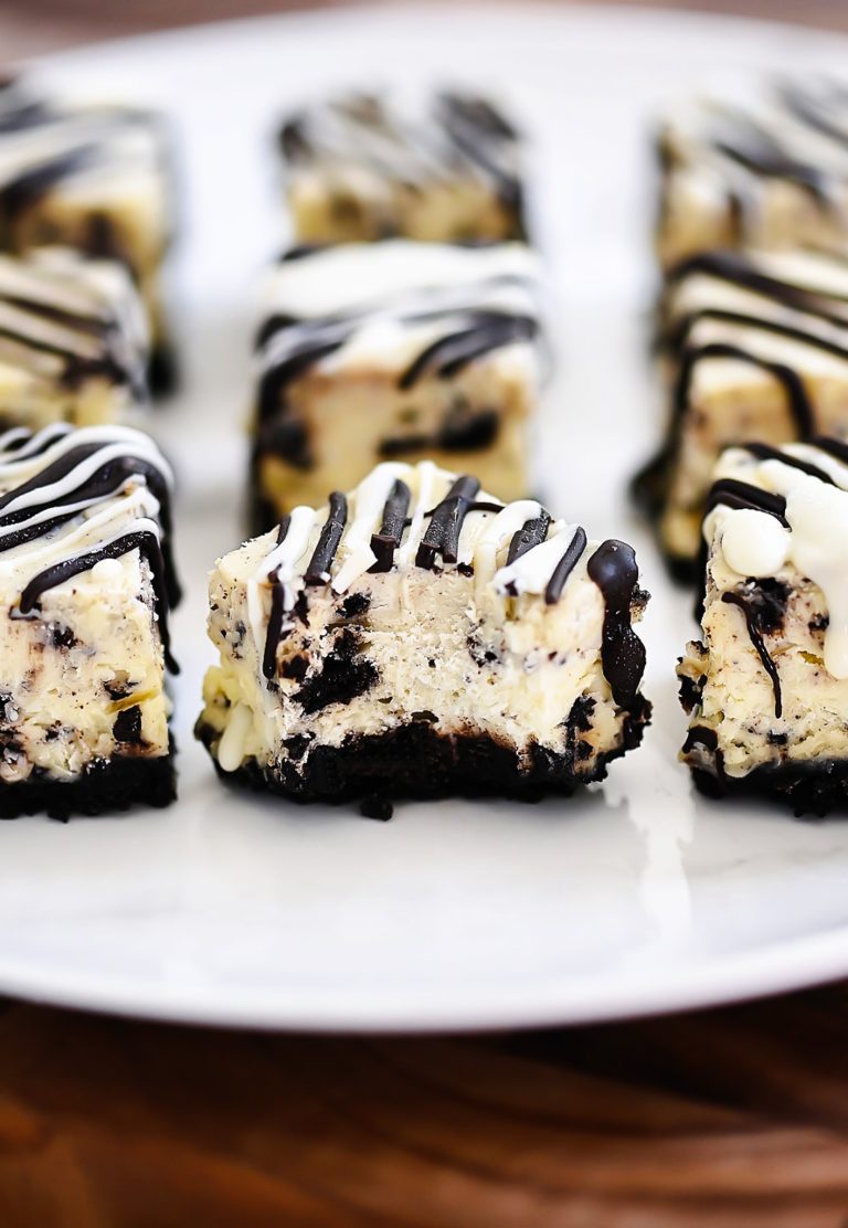 Oreo cheesecake bites are a delicious bite size dessert with an Oreo cookie base and a drizzling of chocolate candy coating. Life-in-the-Lofthouse.com