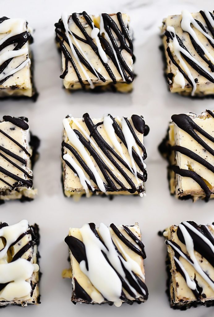 Oreo cheesecake bites are a delicious bite size dessert with an Oreo cookie base and a drizzling of chocolate candy coating. Life-in-the-Lofthouse.com