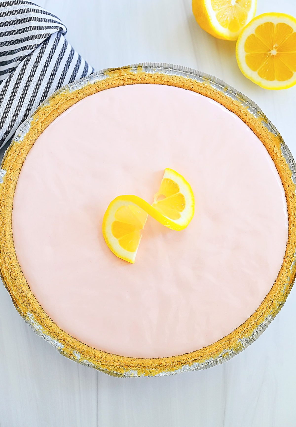 Frozen pink lemonade pie is a refreshing and creamy pie that tastes just like frozen pink lemonade and is made with only 4 ingredients. Life-in-the-Lofthouse.com