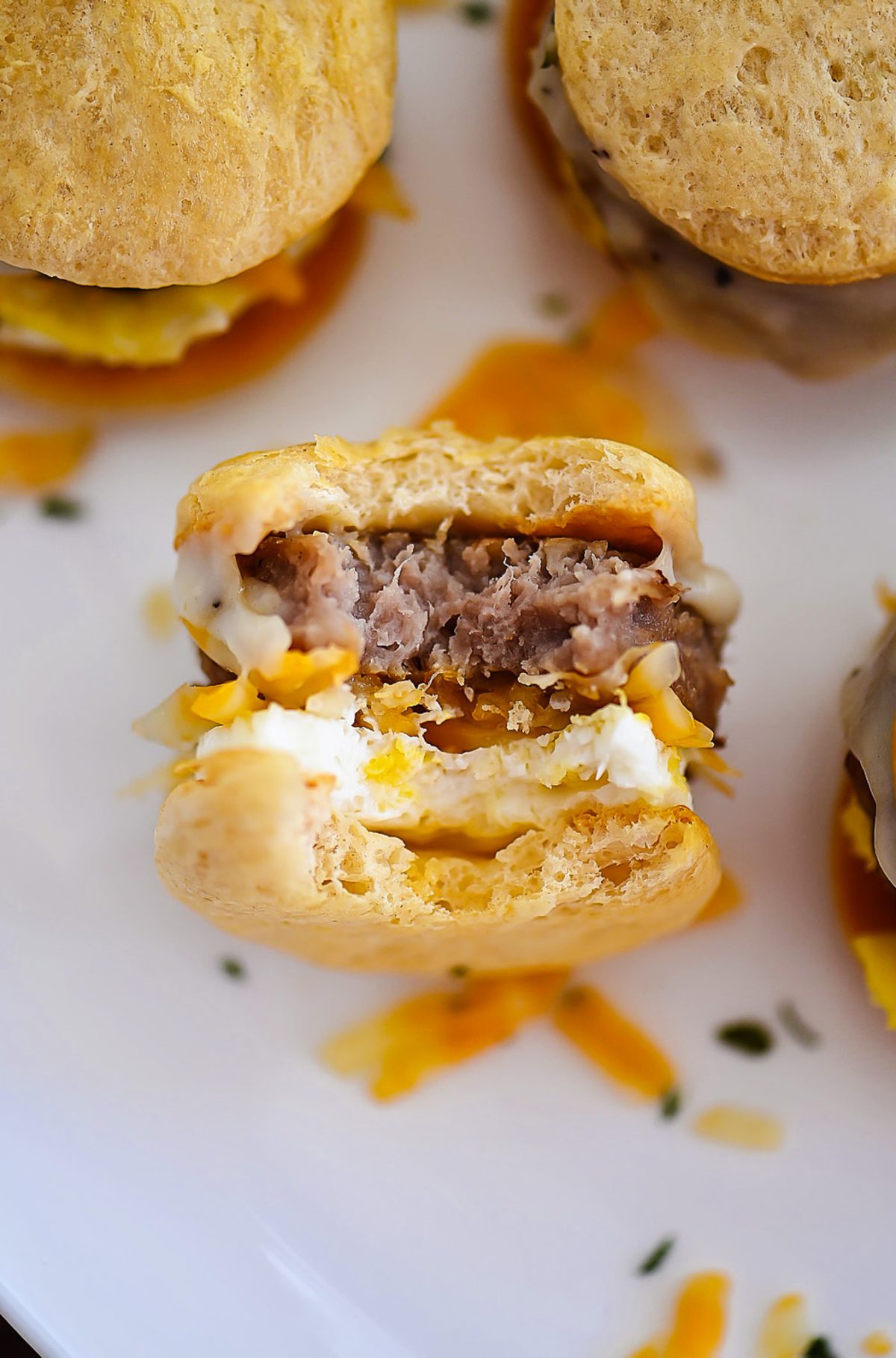 Little savory breakfast sandwiches that will brighten up any morning.&nbsp; These little sliders are layered with flavor and packed with your morning protein.