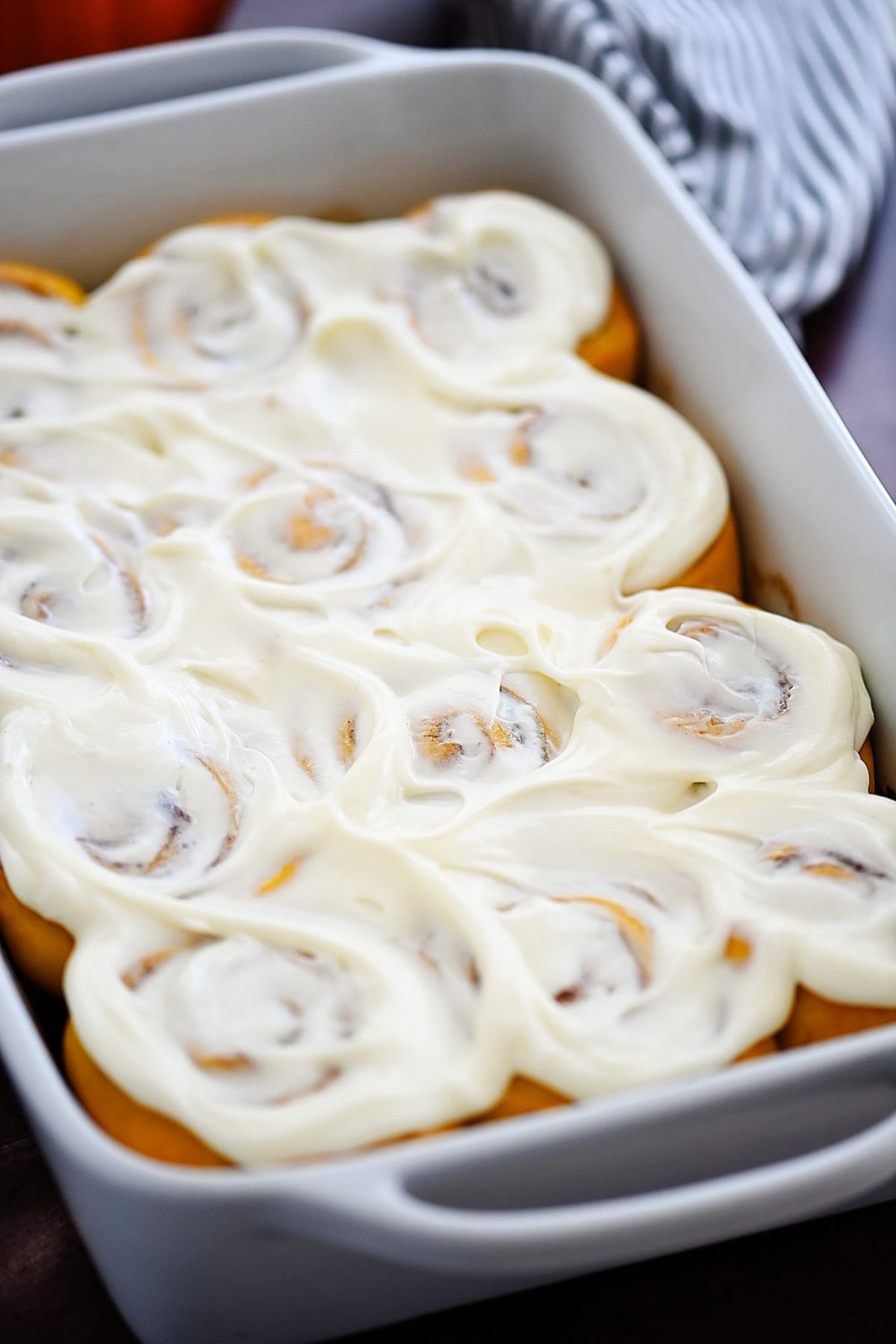 Pumpkin Cinnamon Rolls are soft, delicious cinnamon rolls full of pumpkin flavor and topped with a vanilla and pumpkin flavored icing. Life-in-the-Lofthouse.com