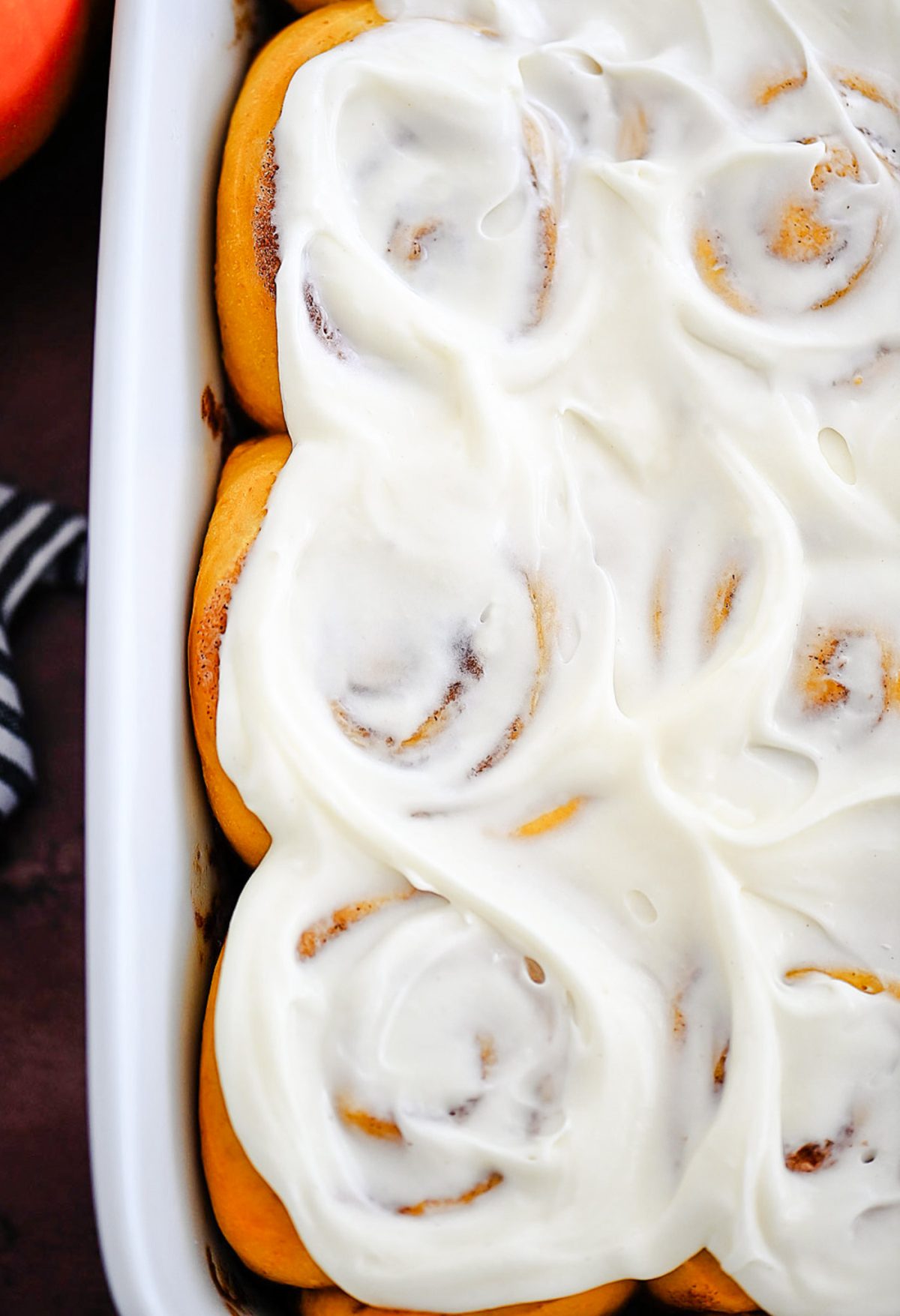 Pumpkin Cinnamon Rolls are soft, delicious cinnamon rolls full of pumpkin flavor and topped with a vanilla and pumpkin flavored icing. Life-in-the-Lofthouse.com
