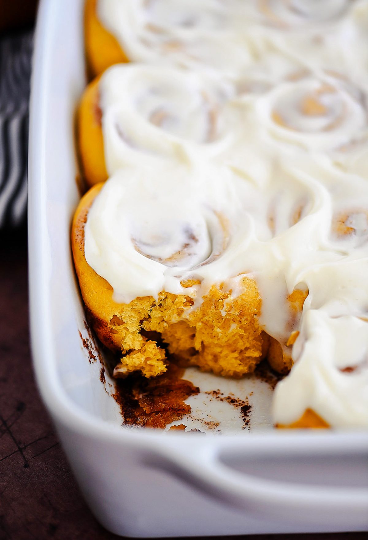 Pumpkin Cinnamon Rolls are soft, delicious cinnamon rolls full of pumpkin flavor and topped with a vanilla and pumpkin flavored icing. Life-in-the-Lofthouse.com