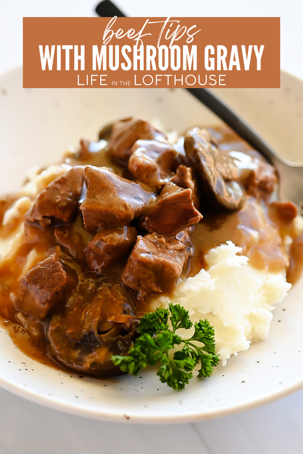 Beef Tips with Mushroom Gravy on a white plate