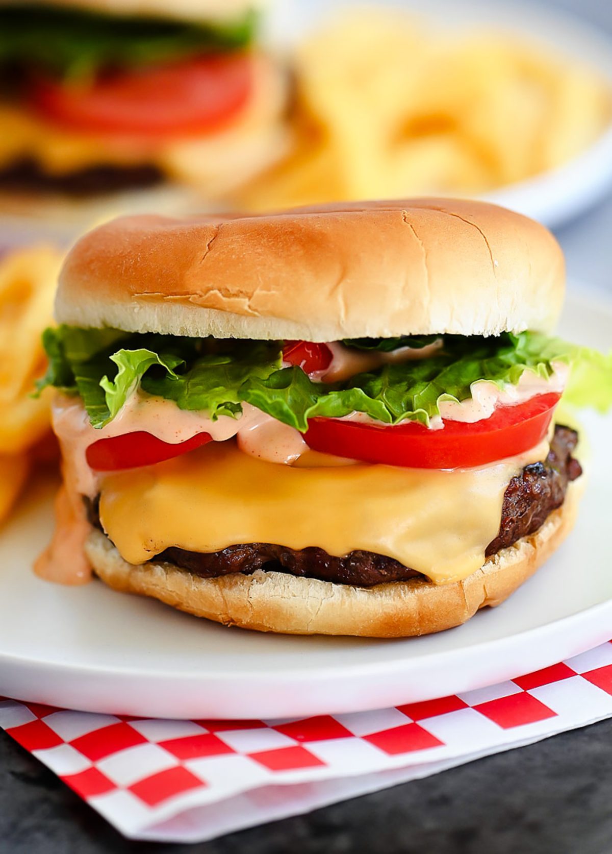 Juicy and flavorful cheeseburgers fresh off the grill that are smothered in a delicious "secret sauce". Life-in-the-Lofthouse.com