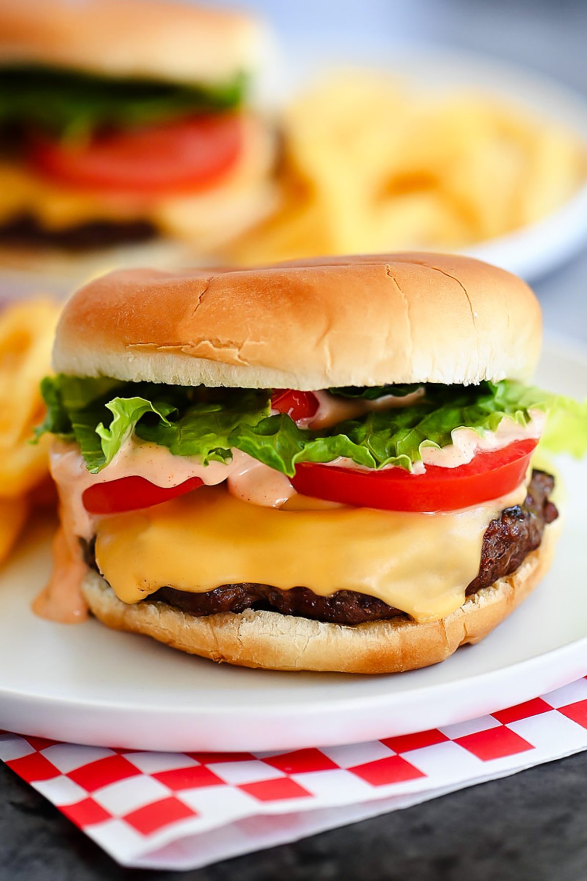 Juicy and flavorful cheeseburgers fresh off the grill that are smothered in a delicious "secret sauce". Life-in-the-Lofthouse.com