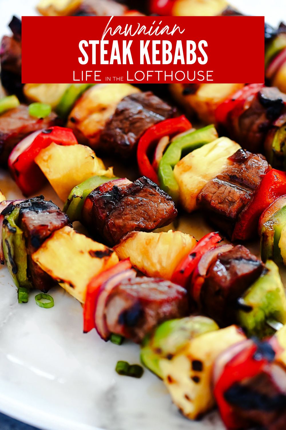 Steak skewers with bell pepper, pineapple and red onion.