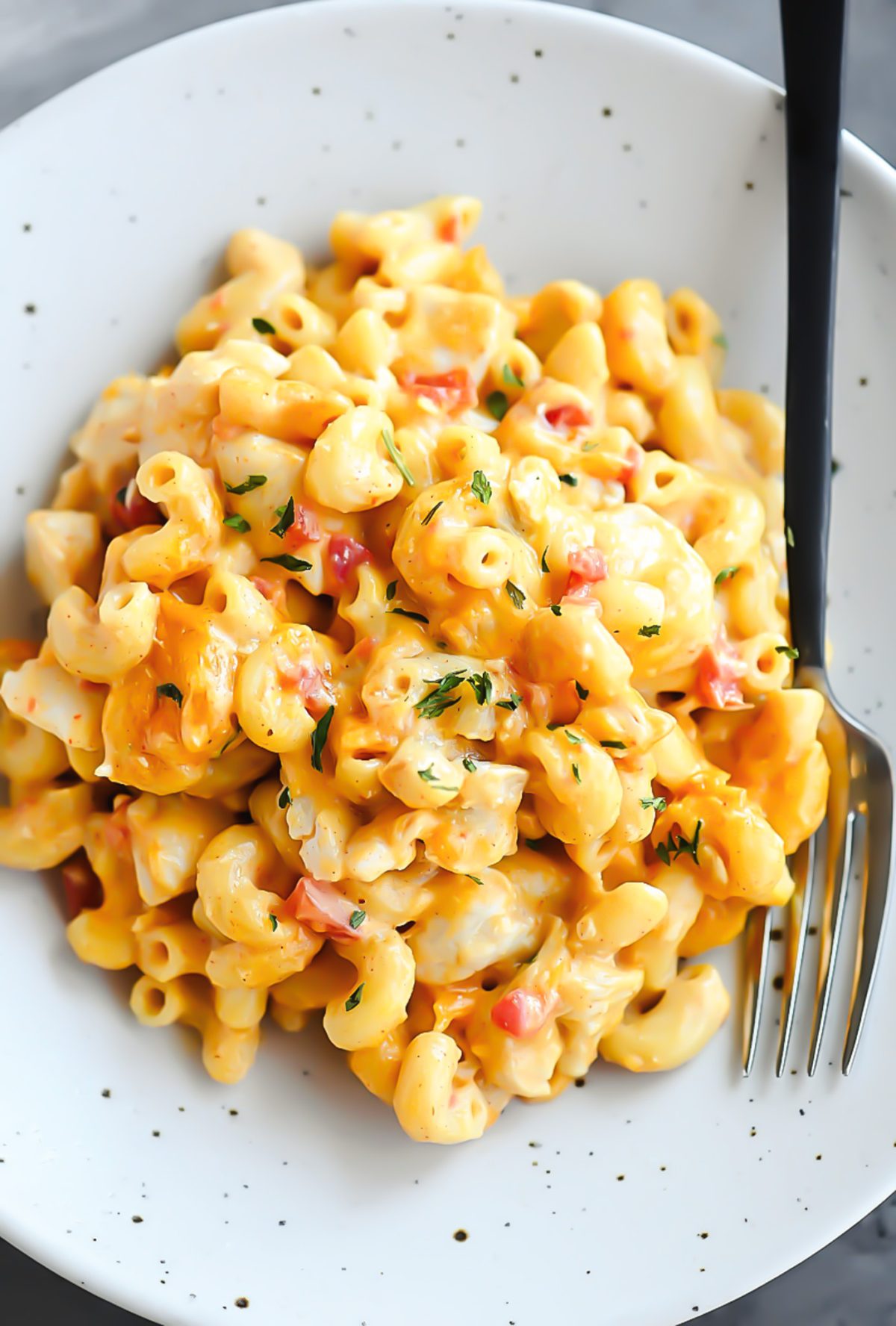 This Mac and Cheese is loaded with chicken, tomatoes, green chilies and more!