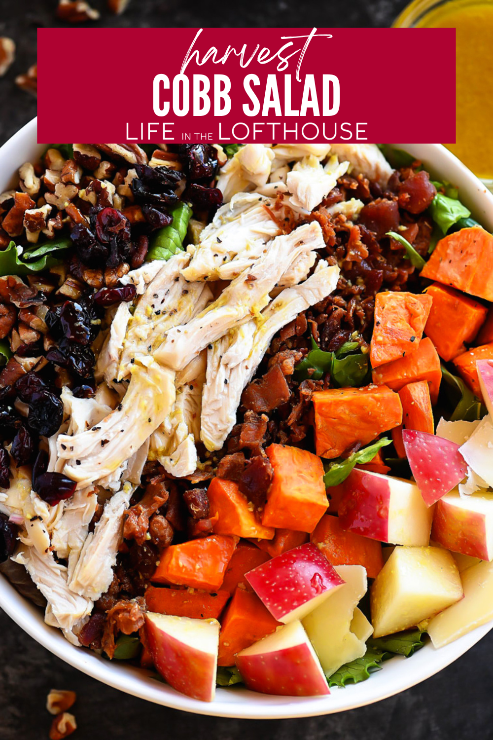 Harvest Cobb Salad is filled with roasted sweet potatoes, crisp apples, bacon, dried cranberries, and shredded turkey. It delivers a satisfying crunch with a touch of sweetness, all balanced by a rich maple vinaigrette.