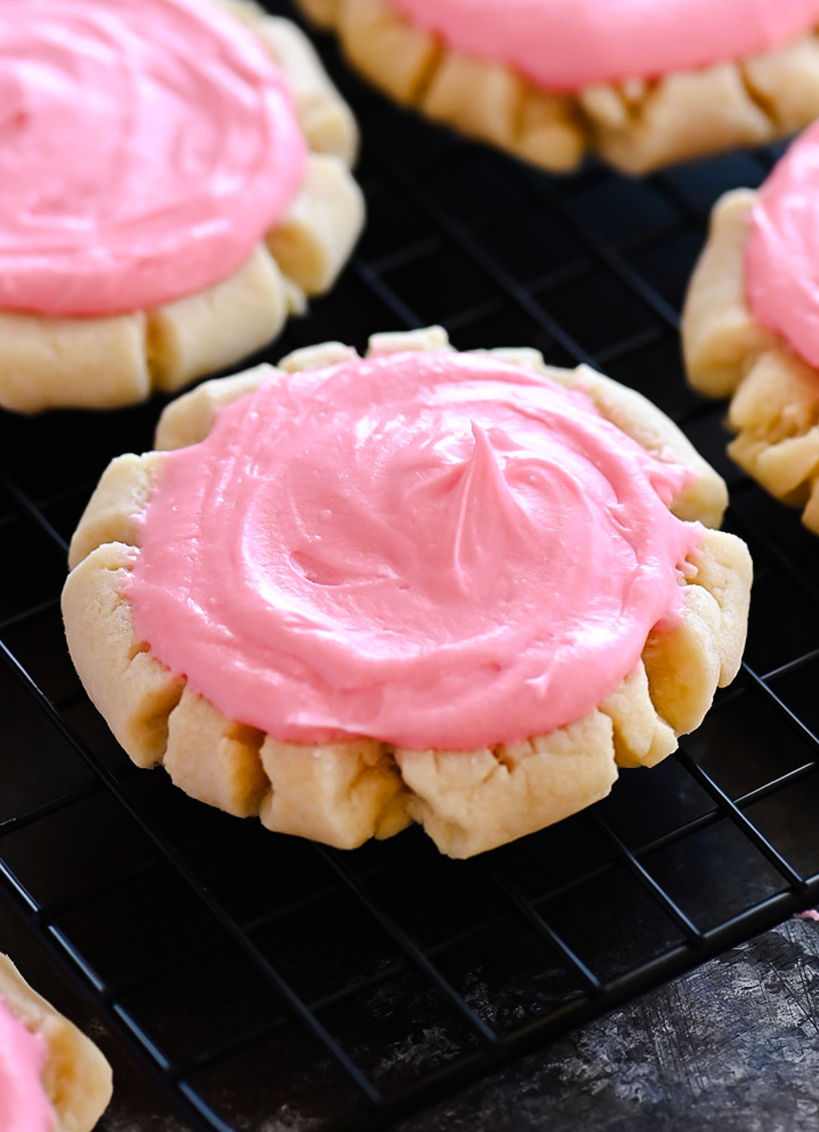 Soft and delicious sugar cookies with a creamy pink frosting. Life-in-the-Lofthouse.com