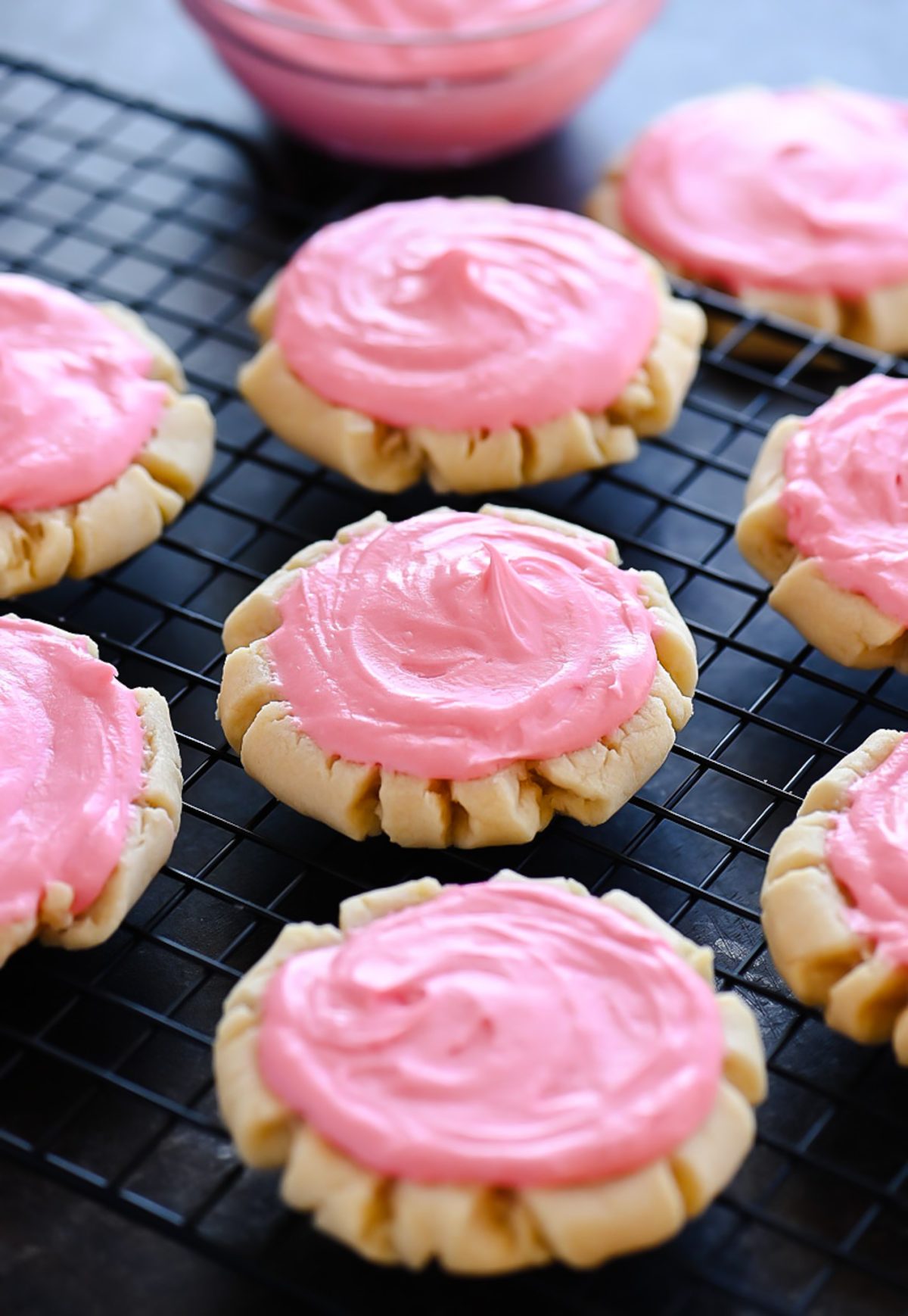 Soft and delicious sugar cookies with a creamy pink frosting. Life-in-the-Lofthouse.com