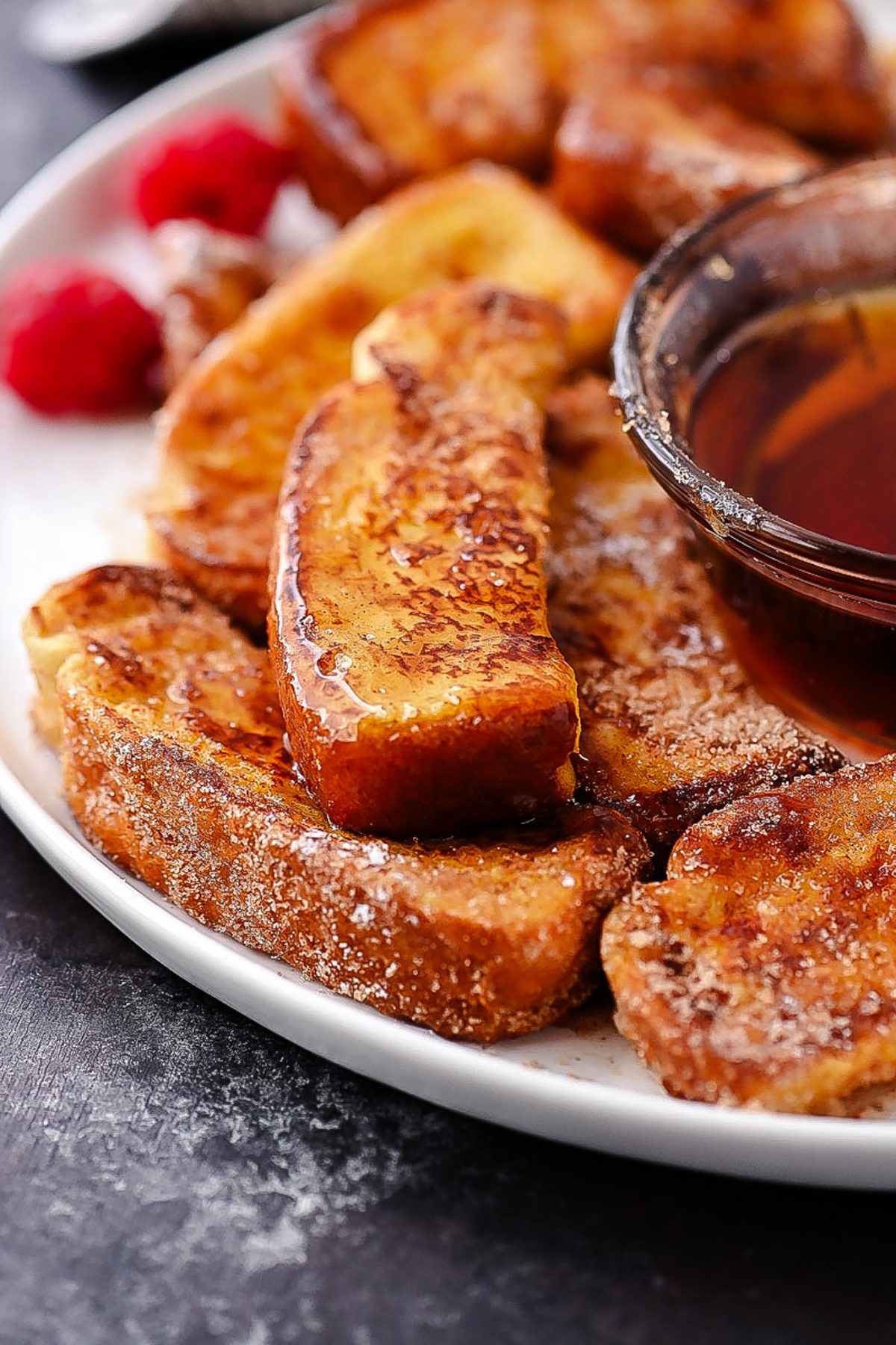 Golden cinnamon French toast sticks coated in cinnamon sugar, perfect for a quick and delicious breakfast or snack.