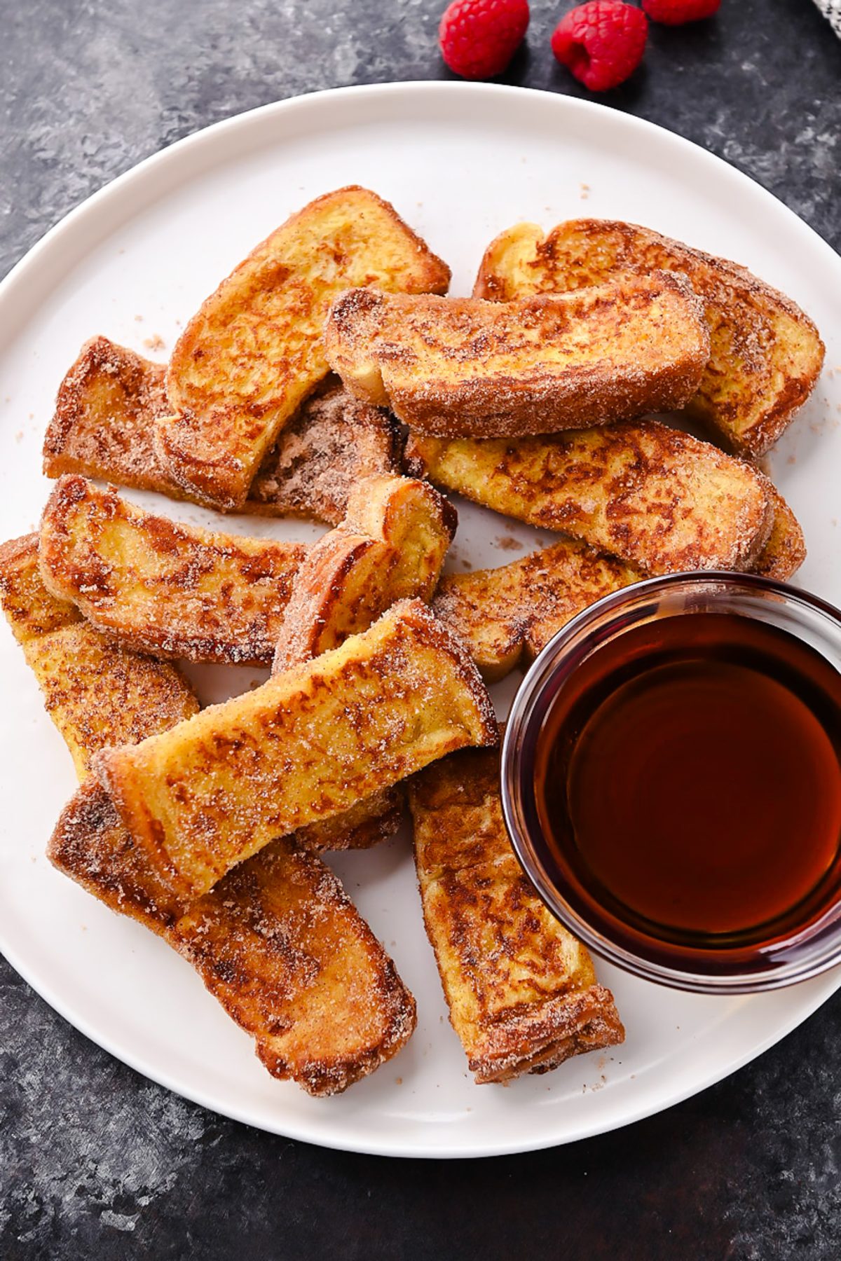 Golden cinnamon French toast sticks coated in cinnamon sugar, perfect for a quick and delicious breakfast or snack.