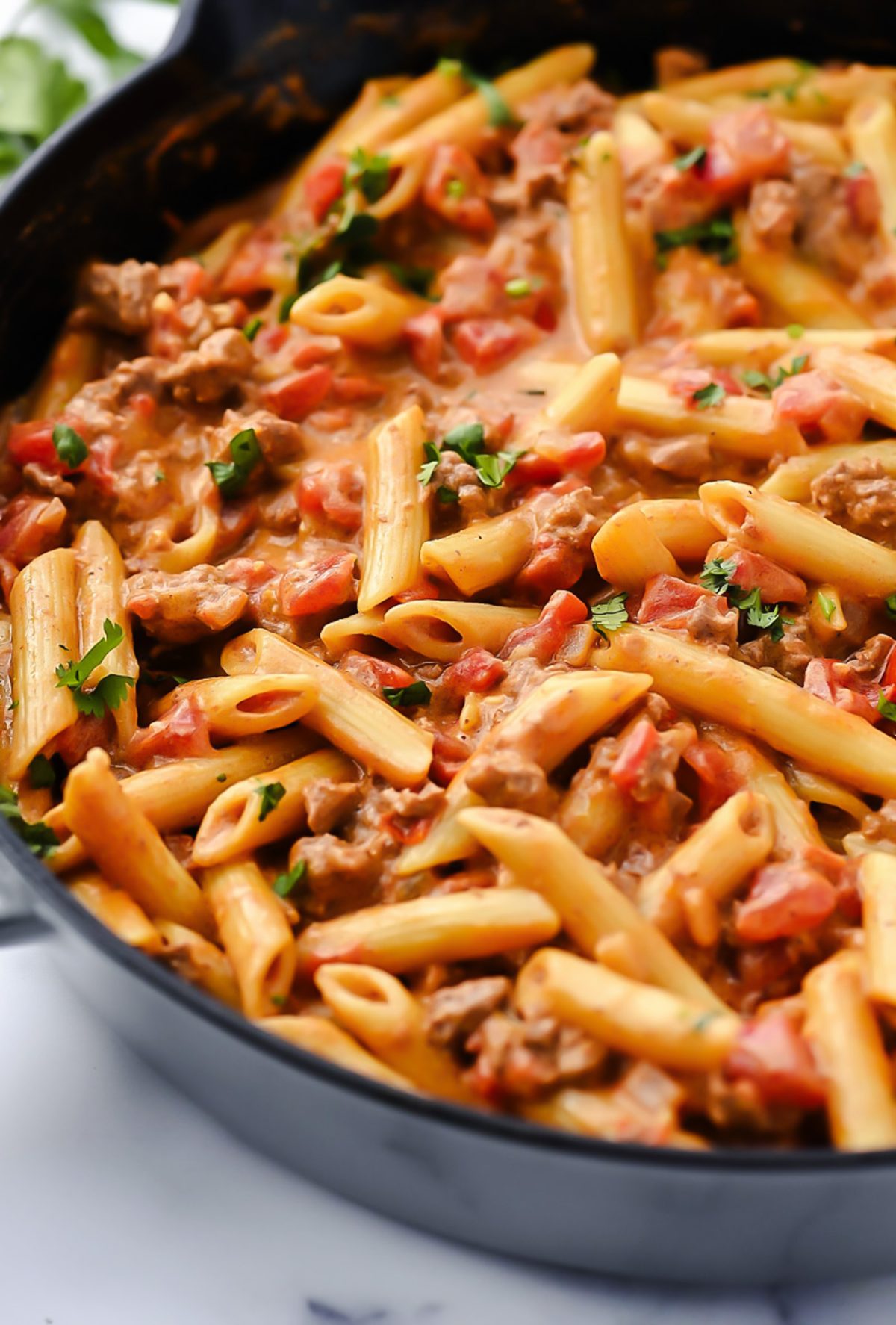 Creamy Tex-Mex pasta with ground beef, Rotel tomatoes, and melted cheese.