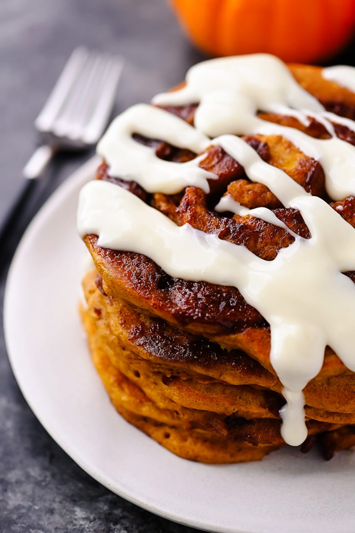 Pumpkin Cinnamon Roll Pancakes with Cream Cheese Glaze