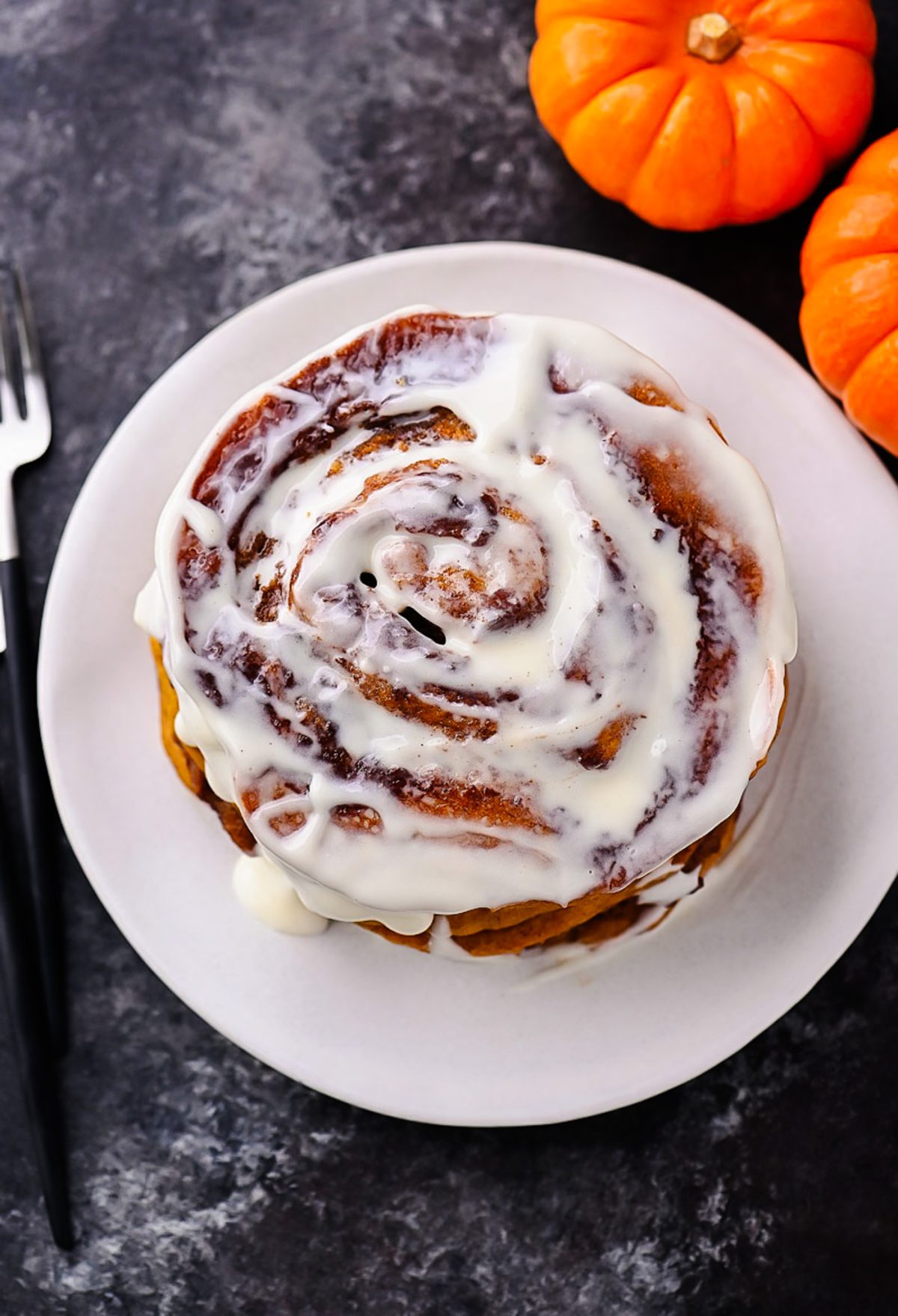 Pumpkin Cinnamon Roll Pancakes with Cream Cheese Glaze