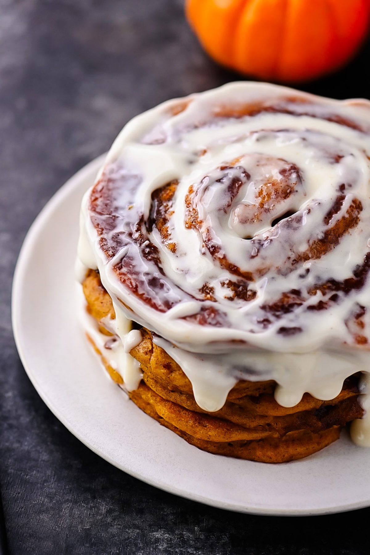 Pumpkin Cinnamon Roll Pancakes with Cream Cheese Glaze