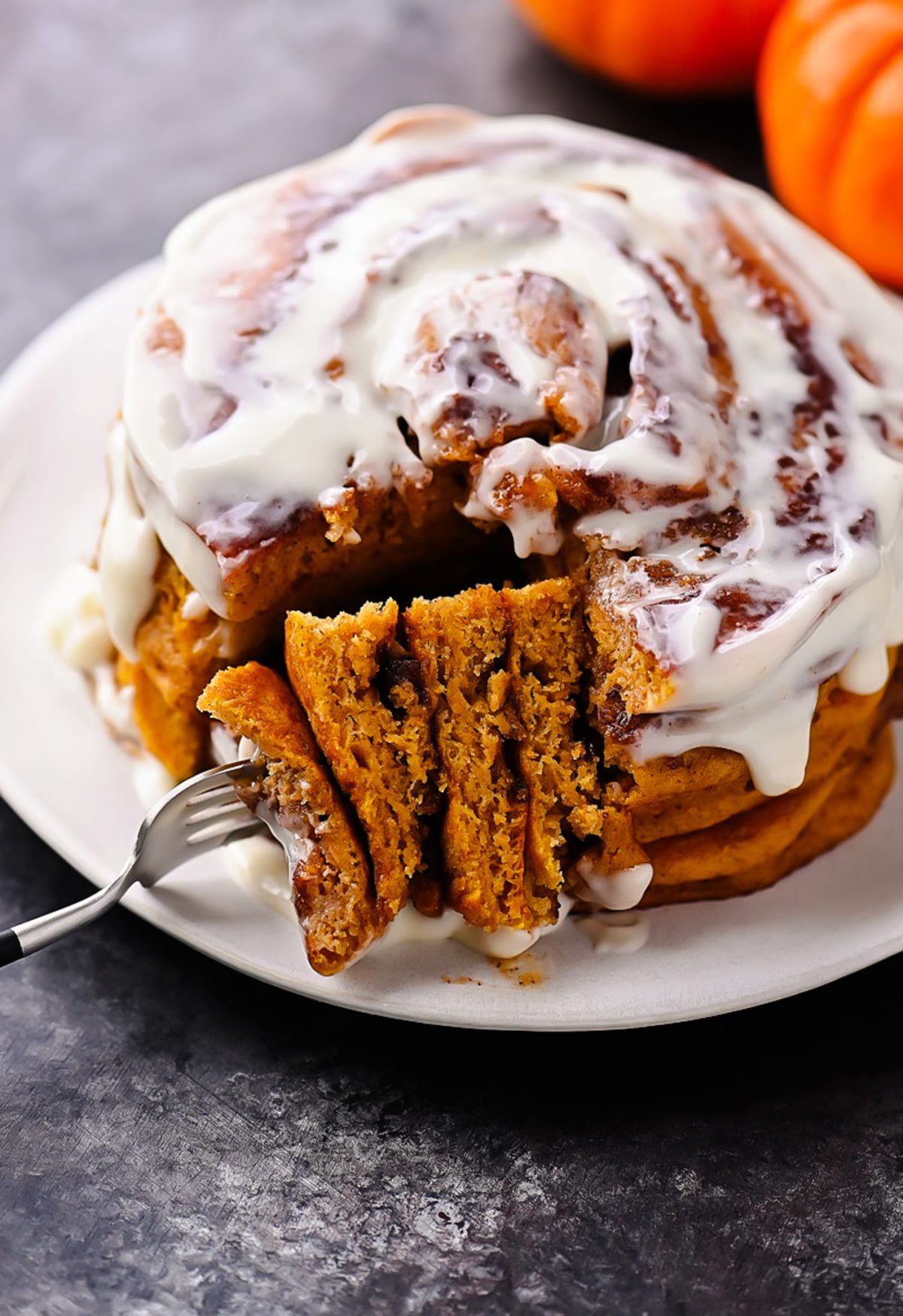 Pumpkin Cinnamon Roll Pancakes with Cream Cheese Glaze