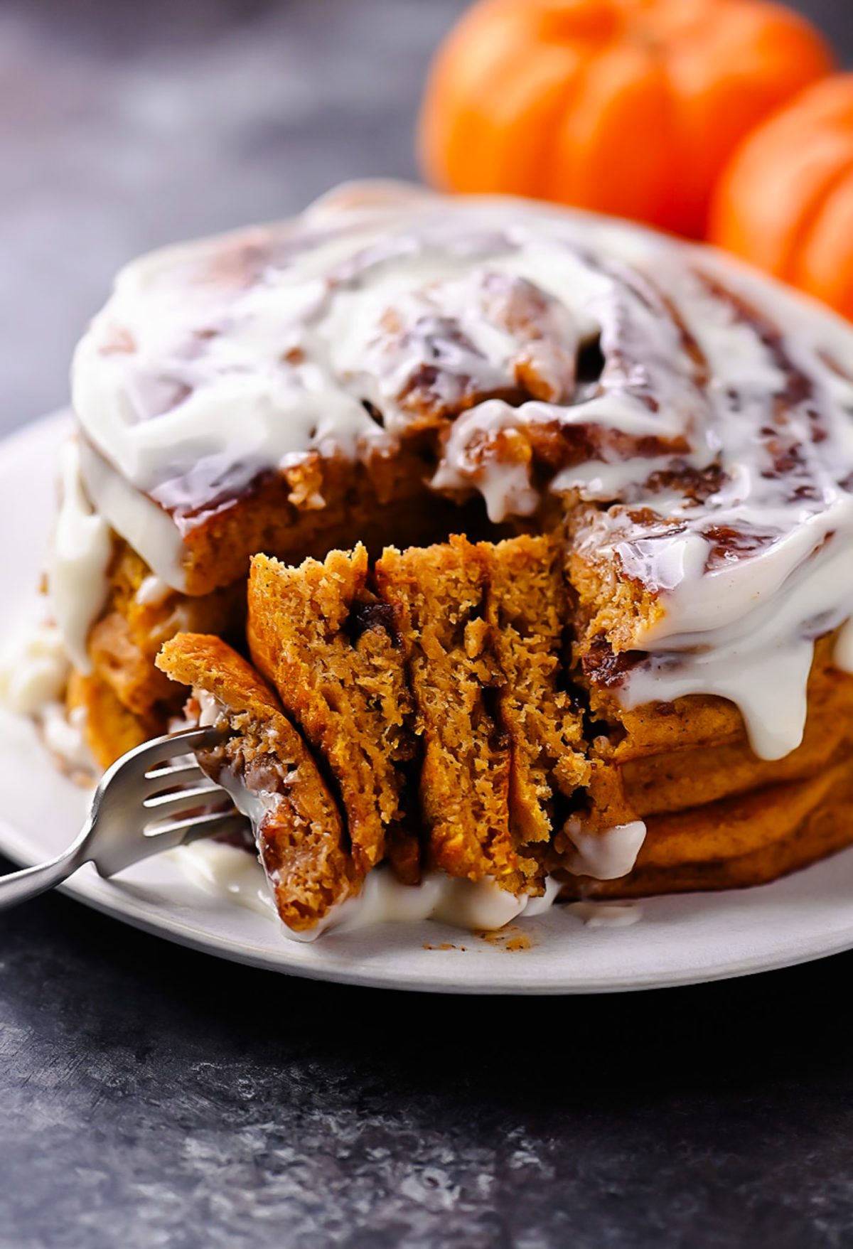 Pumpkin Cinnamon Roll Pancakes with Cream Cheese Glaze