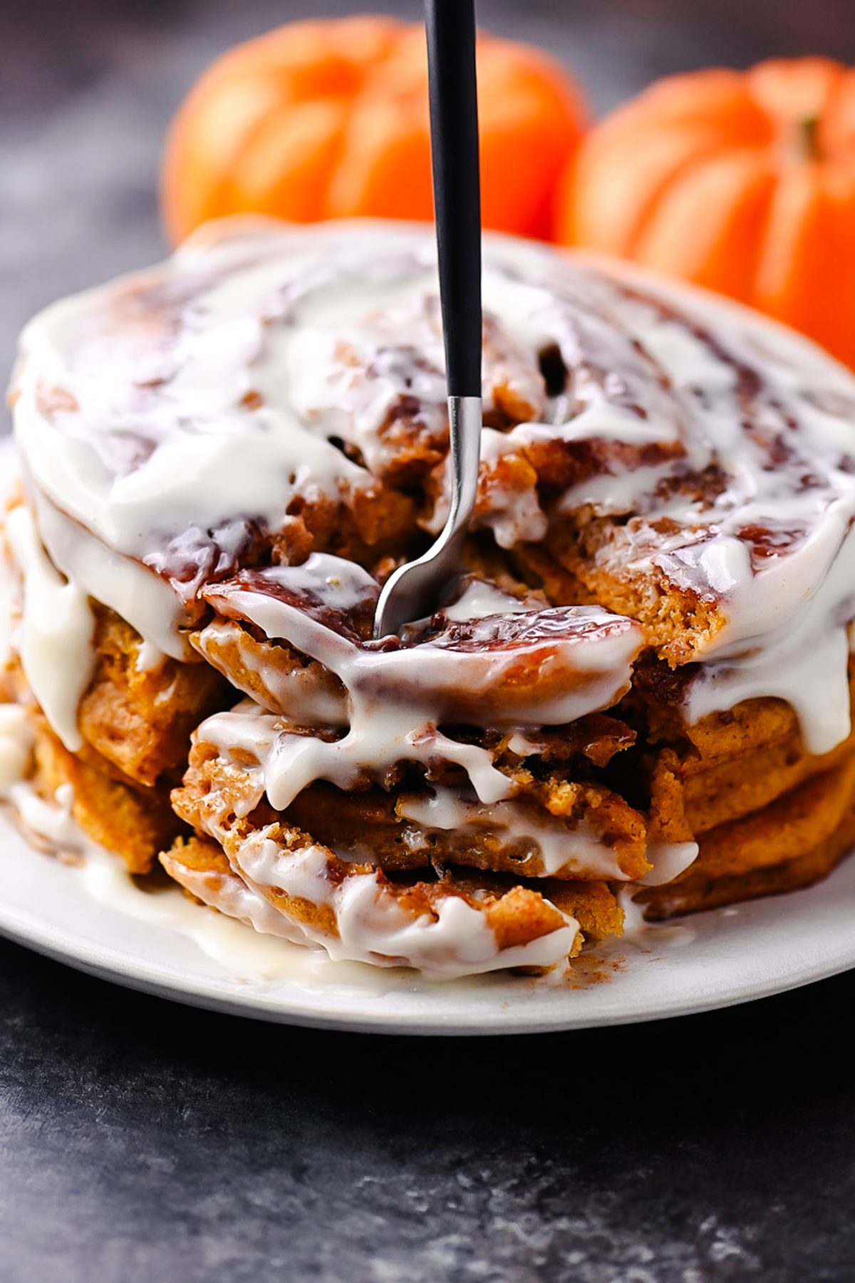 Pumpkin Cinnamon Roll Pancakes with Cream Cheese Glaze