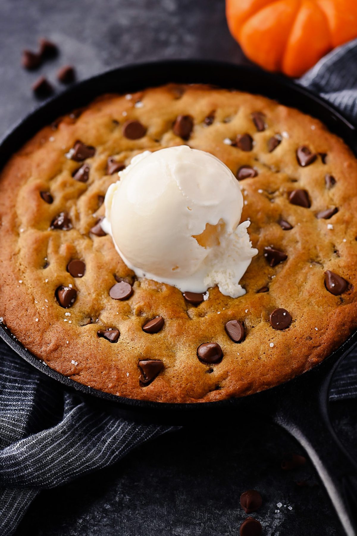 Warm and Gooey Pumpkin Chocolate Chip Cookie Skillet with Vanilla Ice Cream
