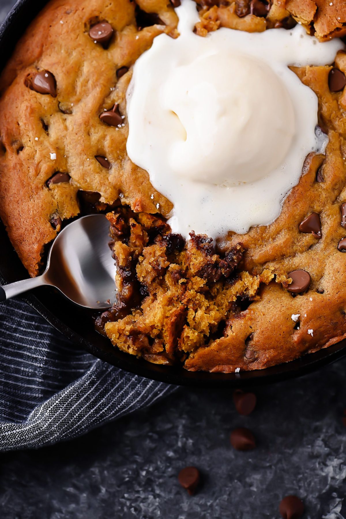 Warm and Gooey Pumpkin Chocolate Chip Cookie Skillet with Vanilla Ice Cream