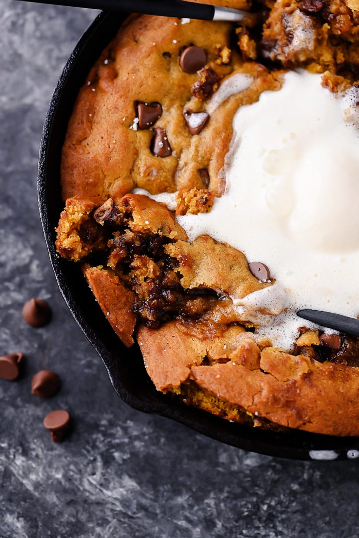 Warm and Gooey Pumpkin Chocolate Chip Cookie Skillet with Vanilla Ice Cream